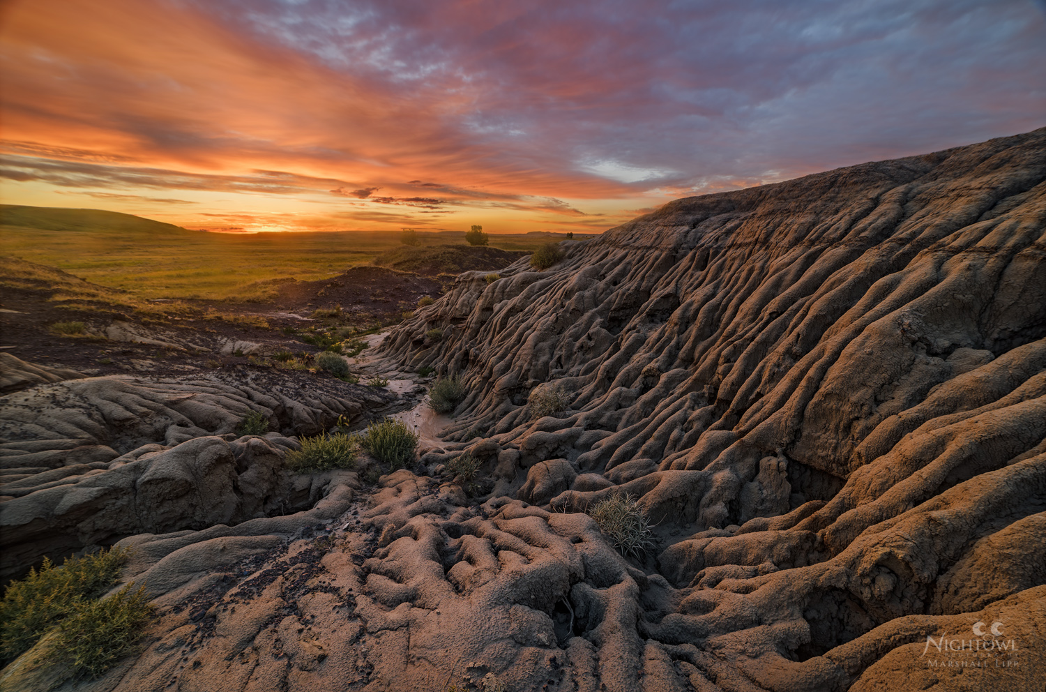 Last light over sculpted badlands