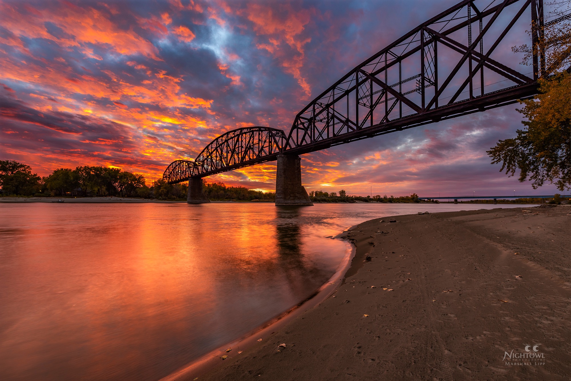 Sunset behind the train bridge
