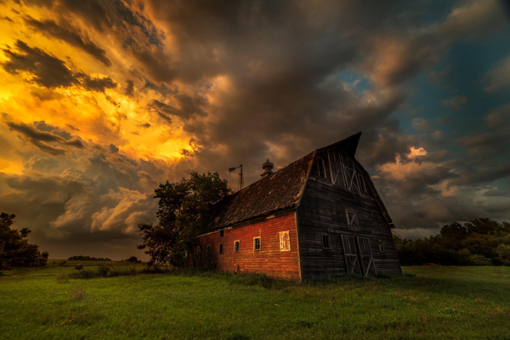 Storm clouds above the red barn
