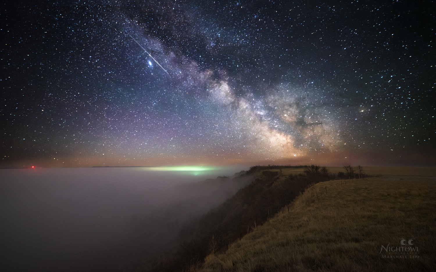 The Milky Way above a quiet shoreline
