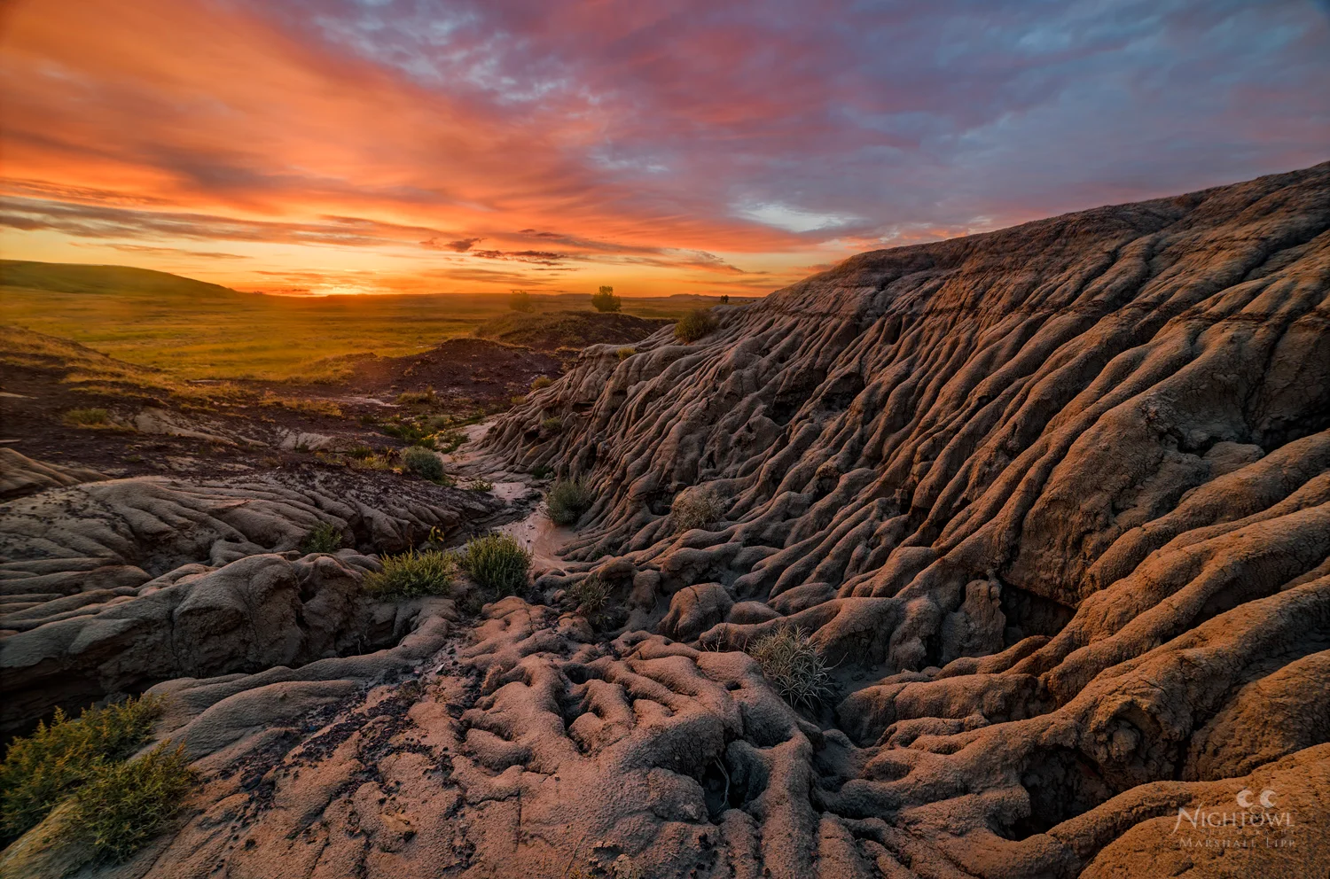 Last light over sculpted badlands