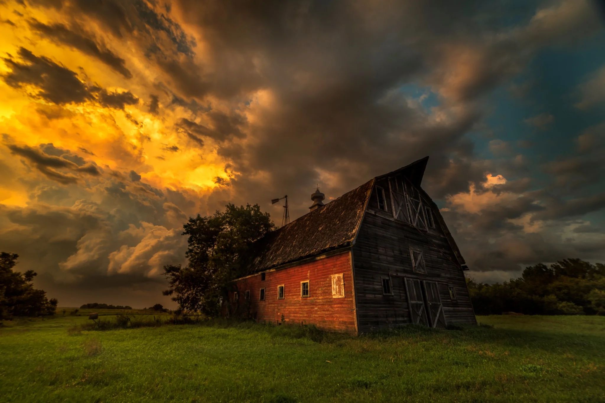 Storm clouds above the red barn