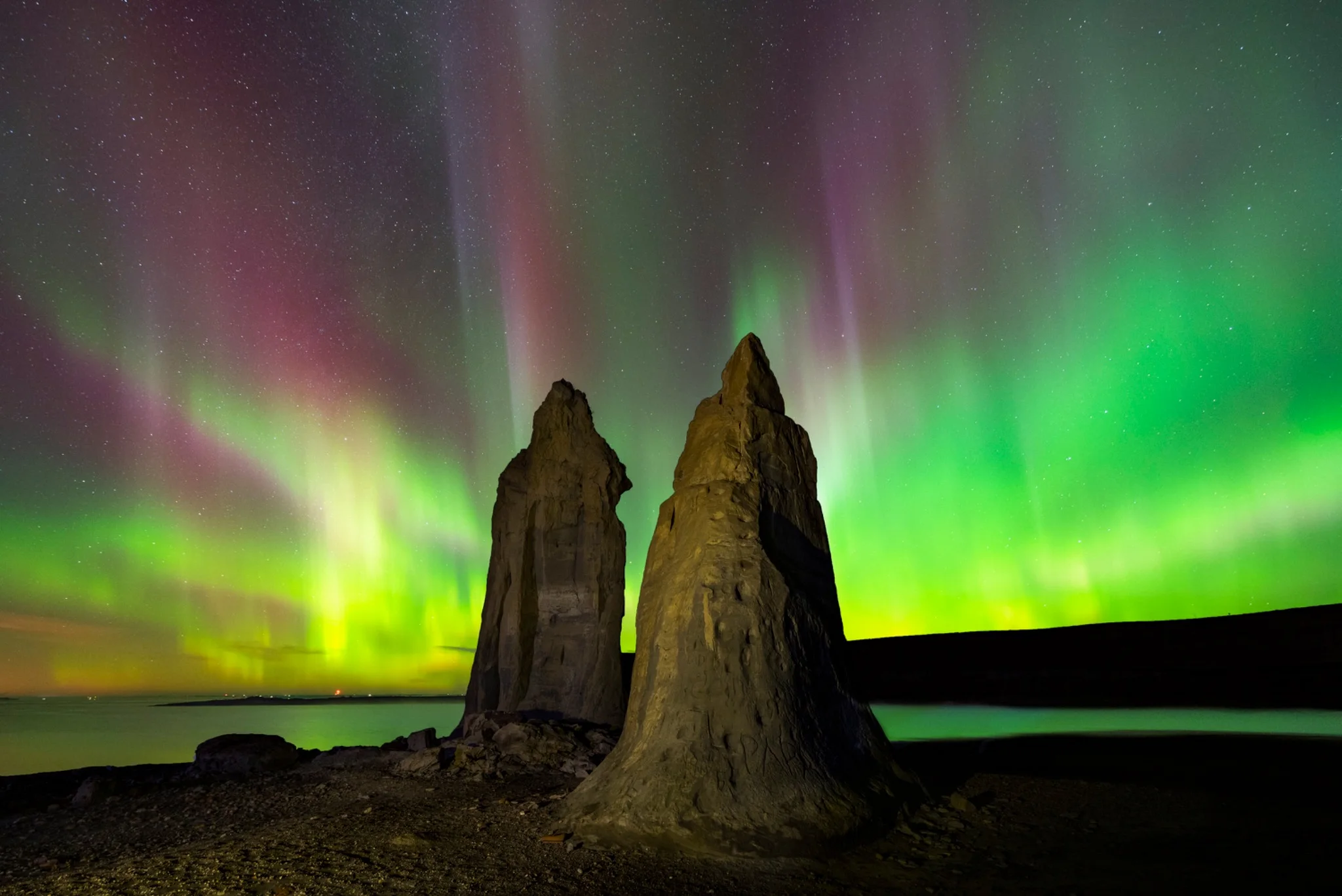 Aurora above the sea stacks