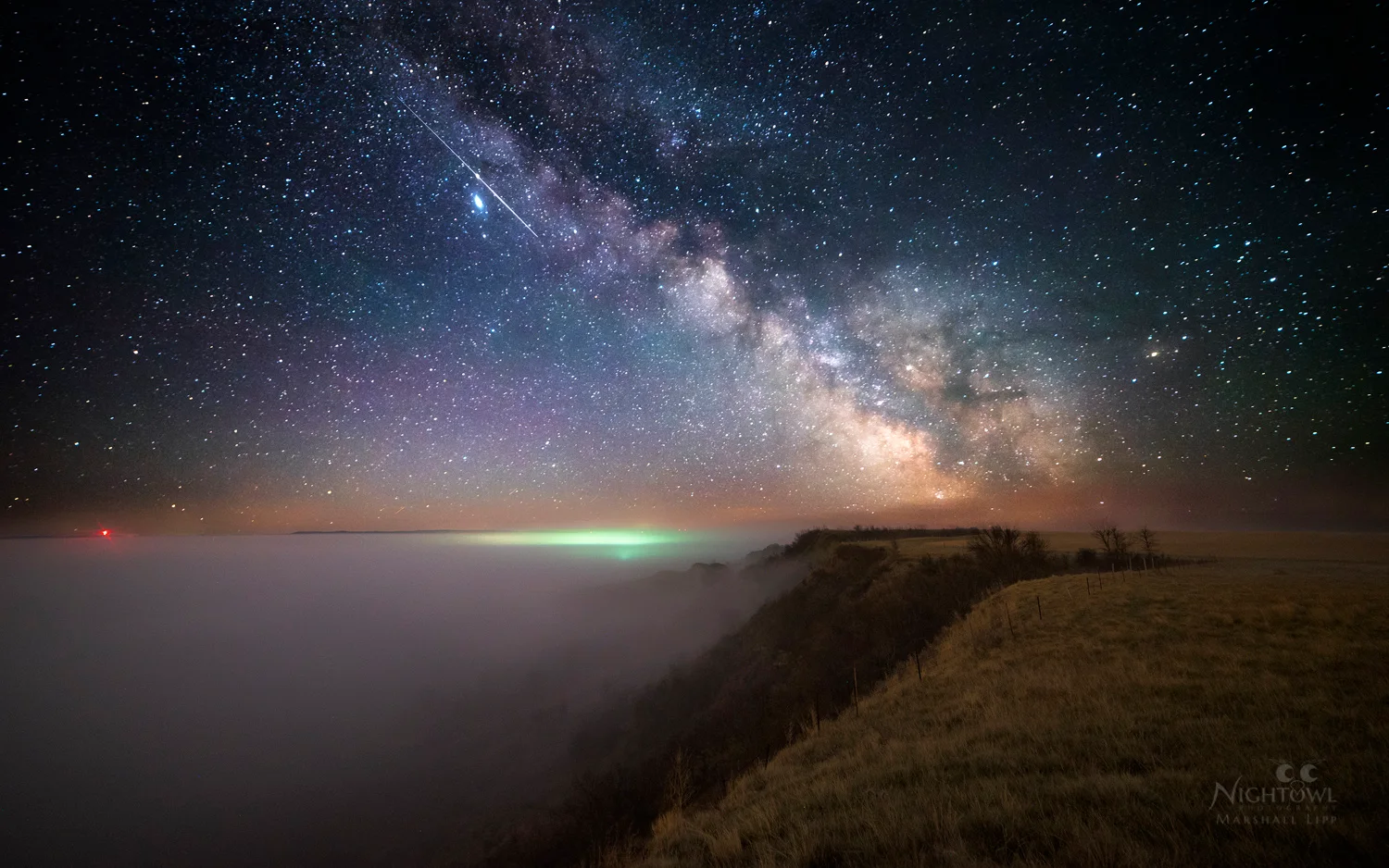 The Milky Way above a quiet shoreline