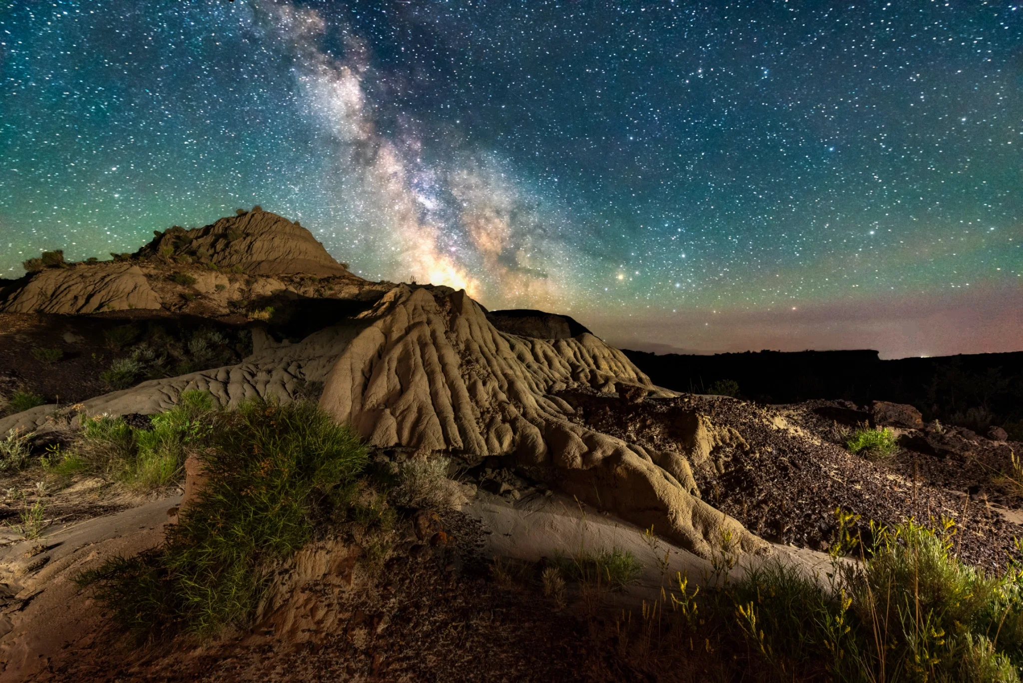 The Milky Way above the badlands